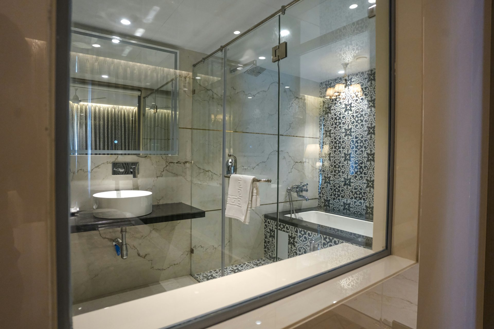 A modern bathroom features a shower and sink.